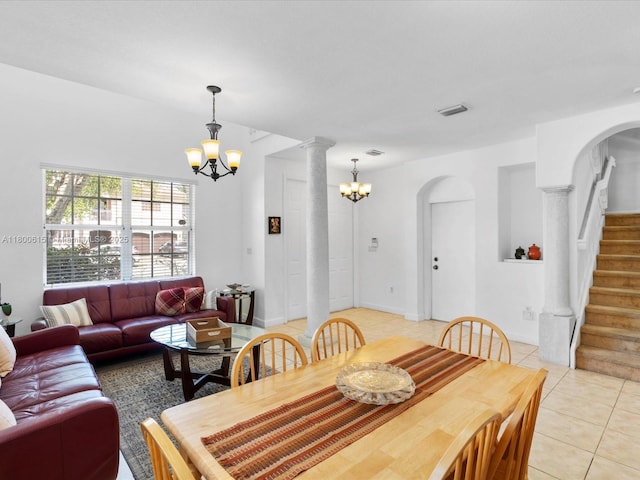 17616 SW 135th Ave, Miami, FL 33177 - dining space featuring a chandelier, light tile patterned floors, arched walkways, stairs, and decorative columns