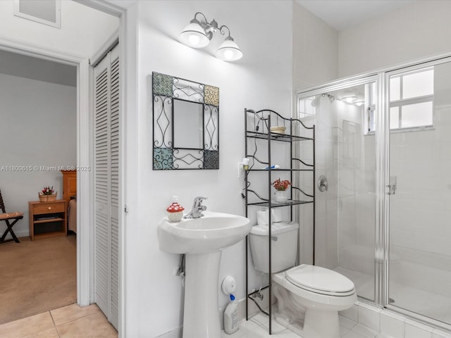 17616 SW 135th Ave, Miami, FL 33177 - bathroom with a shower stall, tile patterned floors, toilet, and a closet