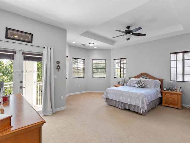 17616 SW 135th Ave, Miami, FL 33177 - bedroom featuring access to exterior, light carpet, a tray ceiling, baseboards, and ceiling fan