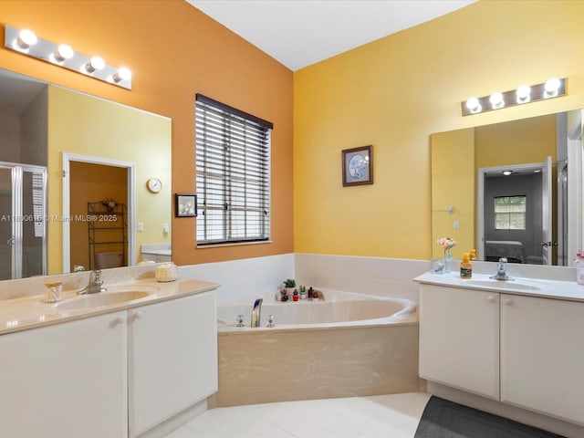 17616 SW 135th Ave, Miami, FL 33177 - ensuite bathroom featuring tile patterned floors, a shower stall, a garden tub, and two vanities