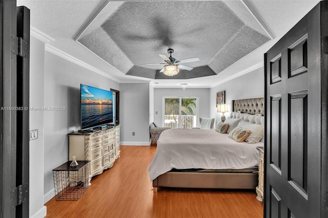 1811 SW 162nd Ave, Miramar, FL 33027 - bedroom with a raised ceiling, wood finished floors, crown molding, access to exterior, and a textured ceiling