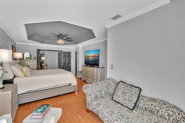 1811 SW 162nd Ave, Miramar, FL 33027 - bedroom with a tray ceiling, ornamental molding, light wood finished floors, and ceiling fan