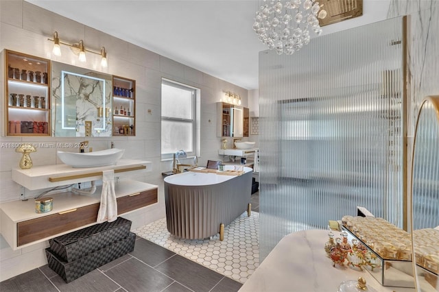 1811 SW 162nd Ave, Miramar, FL 33027 - full bath featuring tile walls, tile patterned floors, a chandelier, a walk in shower, and two vanities