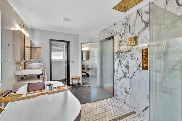 1811 SW 162nd Ave, Miramar, FL 33027 - bathroom with a freestanding tub, vanity, tile patterned flooring, and a marble finish shower