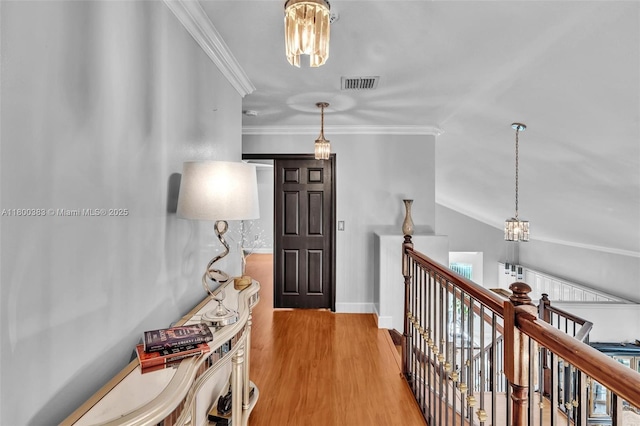 1811 SW 162nd Ave, Miramar, FL 33027 - hall with an upstairs landing, crown molding, a chandelier, wood finished floors, and vaulted ceiling