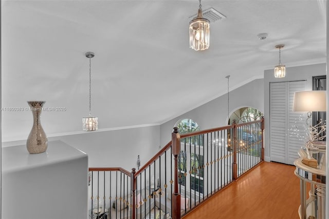 1811 SW 162nd Ave, Miramar, FL 33027 - hallway with an upstairs landing, a chandelier, ornamental molding, and wood finished floors