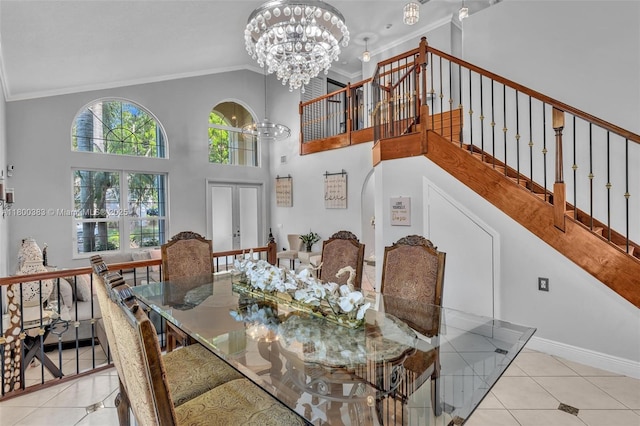 1811 SW 162nd Ave, Miramar, FL 33027 - dining area with ornamental molding, a chandelier, tile patterned floors, stairway, and high vaulted ceiling