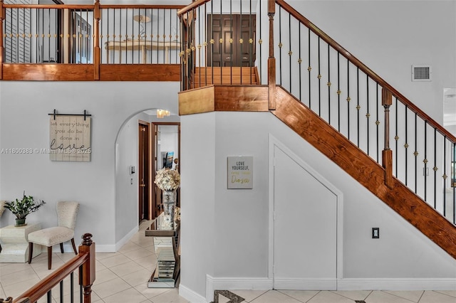 1811 SW 162nd Ave, Miramar, FL 33027 - stairs featuring tile patterned floors, arched walkways, and a high ceiling