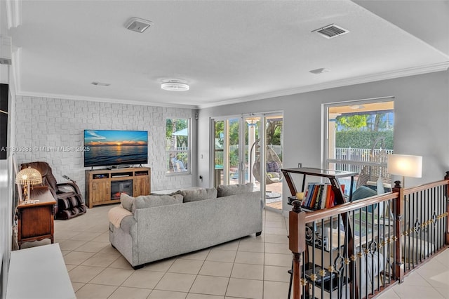1811 SW 162nd Ave, Miramar, FL 33027 - living area with ornamental molding, light tile patterned floors, plenty of natural light, and an accent wall
