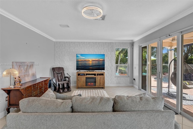 1811 SW 162nd Ave, Miramar, FL 33027 - living area featuring tile patterned flooring, ornamental molding, and a glass covered fireplace