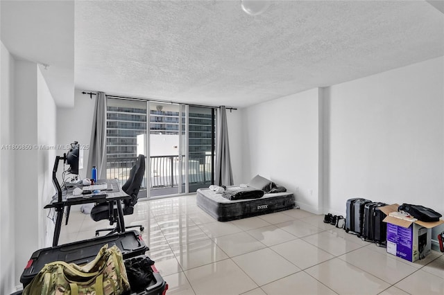 1750 N Bayshore Dr Unit 4007, Miami, FL 33132 - office area with a textured ceiling, floor to ceiling windows, tile patterned flooring, and baseboards