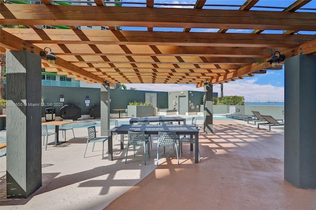 1750 N Bayshore Dr Unit 4007, Miami, FL 33132 - view of patio / terrace with a pergola, a community pool, and outdoor dining space