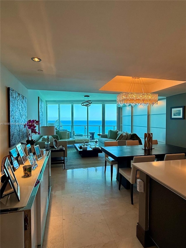 17001 Collins Ave Unit 3005, Sunny Isles Beach, FL 33160 - dining area with floor to ceiling windows and a chandelier