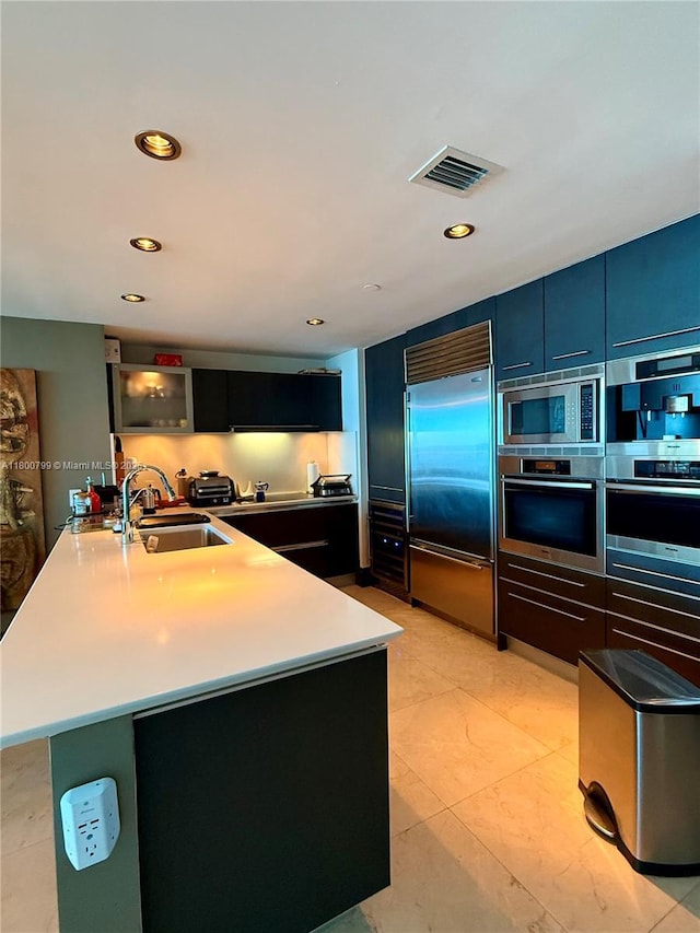 17001 Collins Ave Unit 3005, Sunny Isles Beach, FL 33160 - kitchen with built in appliances, a sink, modern cabinets, light countertops, and recessed lighting
