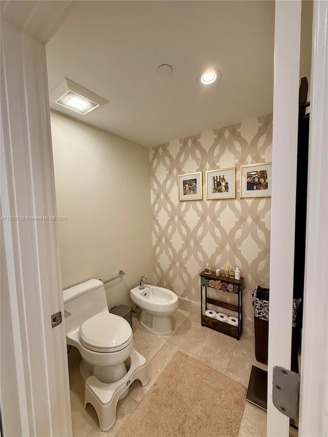 17001 Collins Ave Unit 3005, Sunny Isles Beach, FL 33160 - half bathroom with wallpapered walls, toilet, a bidet, recessed lighting, and tile patterned floors