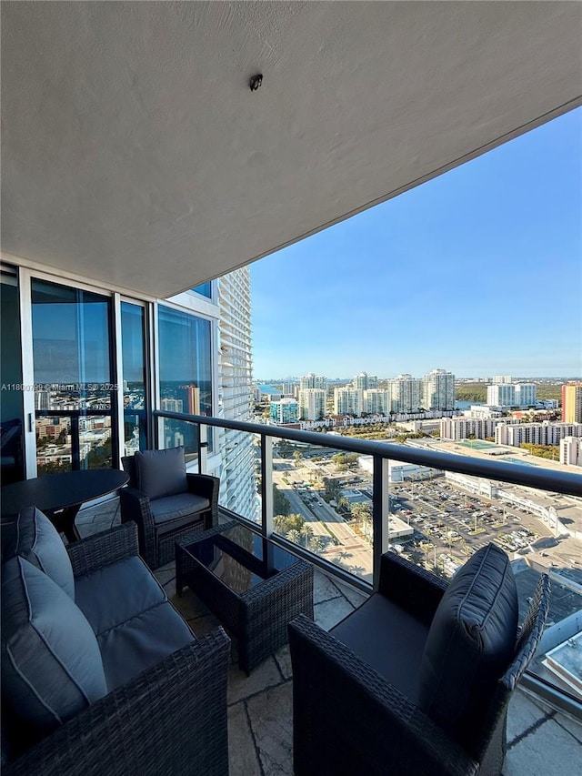 17001 Collins Ave Unit 3005, Sunny Isles Beach, FL 33160 - balcony featuring a city view and outdoor lounge area
