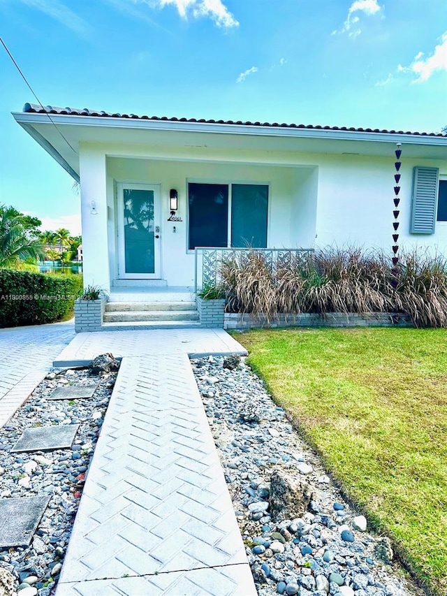 10361 NE 4th Ave, Miami Shores, FL 33138 - entrance to property with a yard and stucco siding