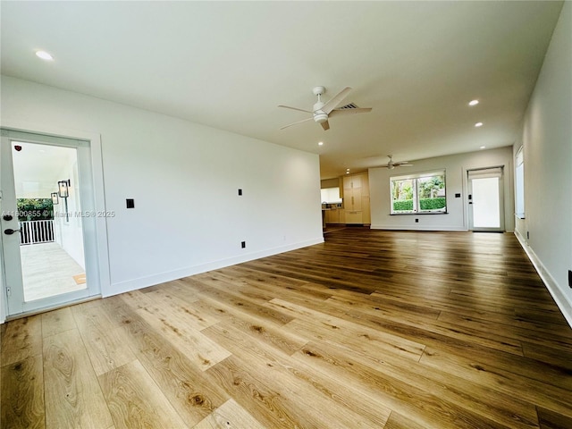10361 NE 4th Ave, Miami Shores, FL 33138 - unfurnished living room featuring hardwood / wood-style floors, a ceiling fan, baseboards, and recessed lighting