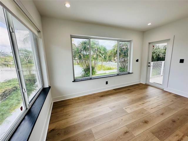 10361 NE 4th Ave, Miami Shores, FL 33138 - unfurnished dining area featuring hardwood / wood-style floors, recessed lighting, and baseboards