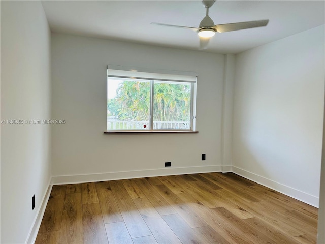 10361 NE 4th Ave, Miami Shores, FL 33138 - unfurnished room featuring wood finished floors, ceiling fan, and baseboards