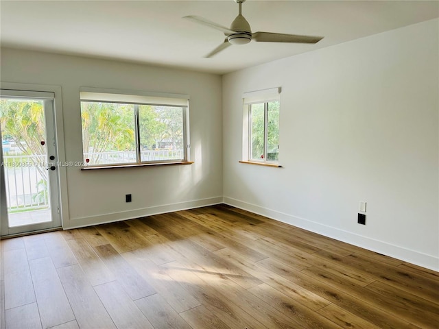 10361 NE 4th Ave, Miami Shores, FL 33138 - empty room with ceiling fan, wood finished floors, and baseboards