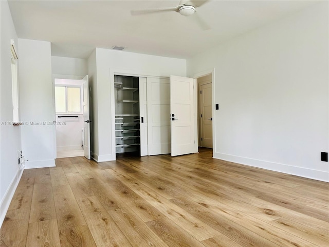 10361 NE 4th Ave, Miami Shores, FL 33138 - unfurnished bedroom with light wood finished floors, baseboards, a closet, and ceiling fan