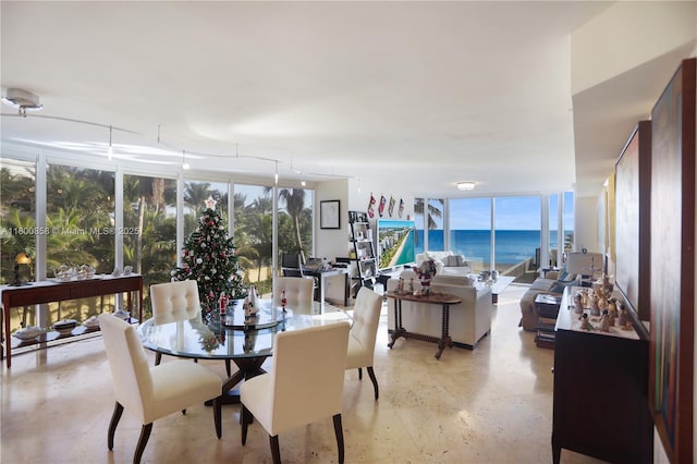 dining room featuring healthy amount of natural light and a water view