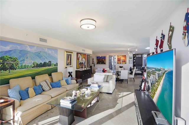 living area featuring a mountain view and finished concrete floors