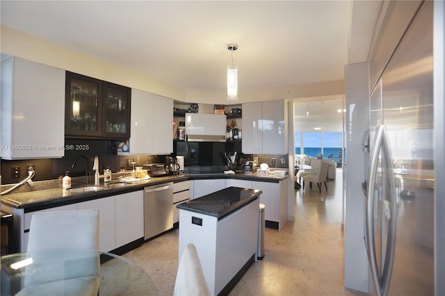 17555 Collins Ave Unit 308, Sunny Isles Beach, FL 33160 - kitchen with stainless steel appliances, open shelves, white cabinetry, pendant lighting, and a center island