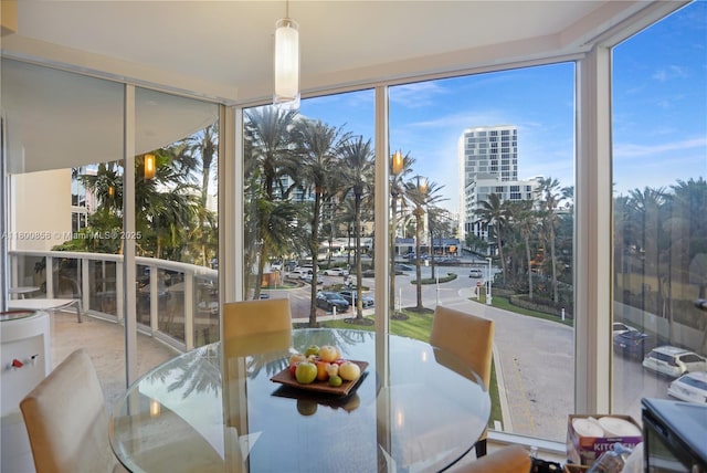 dining space featuring expansive windows