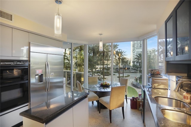 dining room featuring floor to ceiling windows