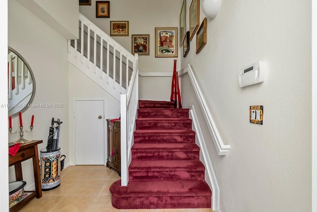 6893 Sterling Grns Unit 201, Naples, FL 34104 - stairway featuring tile patterned flooring