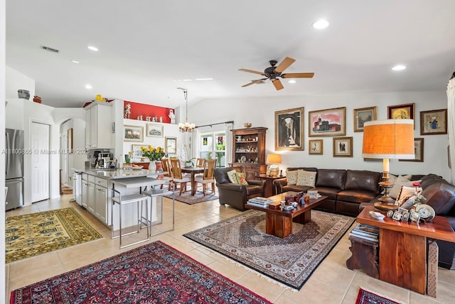 6893 Sterling Grns Unit 201, Naples, FL 34104 - living area with lofted ceiling, ceiling fan, light tile patterned floors, arched walkways, and a chandelier
