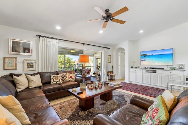6893 Sterling Grns Unit 201, Naples, FL 34104 - living room featuring arched walkways, a ceiling fan, recessed lighting, and light tile patterned floors