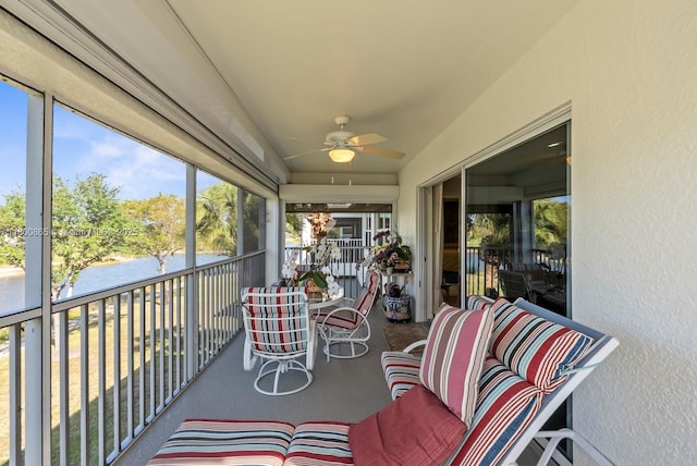 6893 Sterling Grns Unit 201, Naples, FL 34104 - sunroom featuring a water view and a ceiling fan