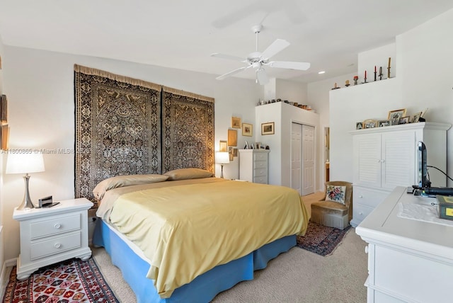 6893 Sterling Grns Unit 201, Naples, FL 34104 - bedroom featuring light carpet, a closet, a ceiling fan, and recessed lighting