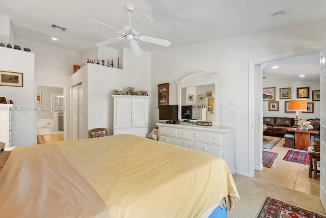 6893 Sterling Grns Unit 201, Naples, FL 34104 - bedroom featuring recessed lighting, ensuite bath, light tile patterned floors, a ceiling fan, and light colored carpet