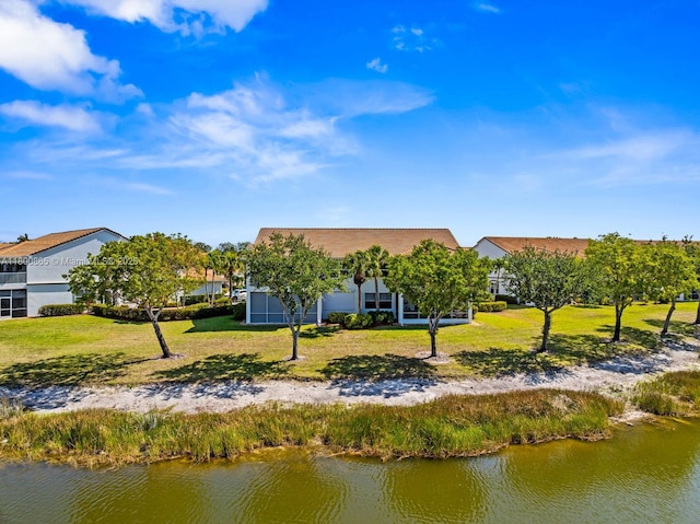 6893 Sterling Grns Unit 201, Naples, FL 34104 - back of property with a water view and a lawn