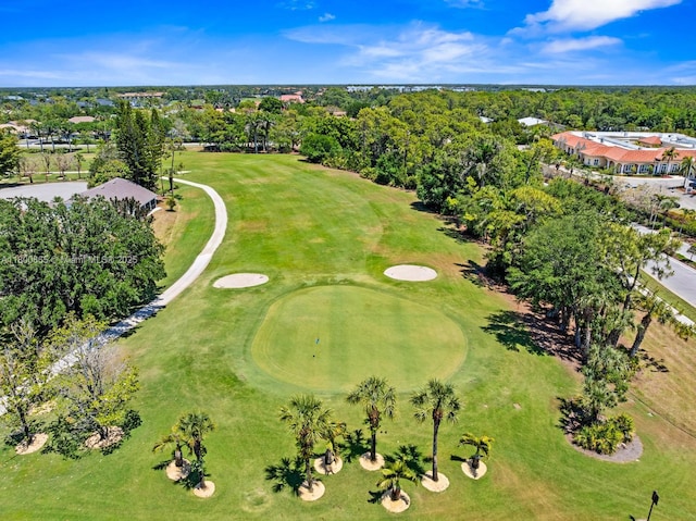 6893 Sterling Grns Unit 201, Naples, FL 34104 - aerial view of property's location with a local golf course and a tree filled landscape