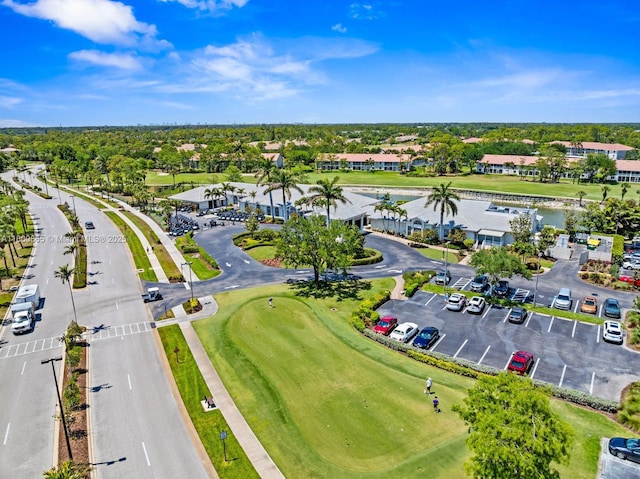 6893 Sterling Grns Unit 201, Naples, FL 34104 - drone / aerial view of a large body of water and a local golf course