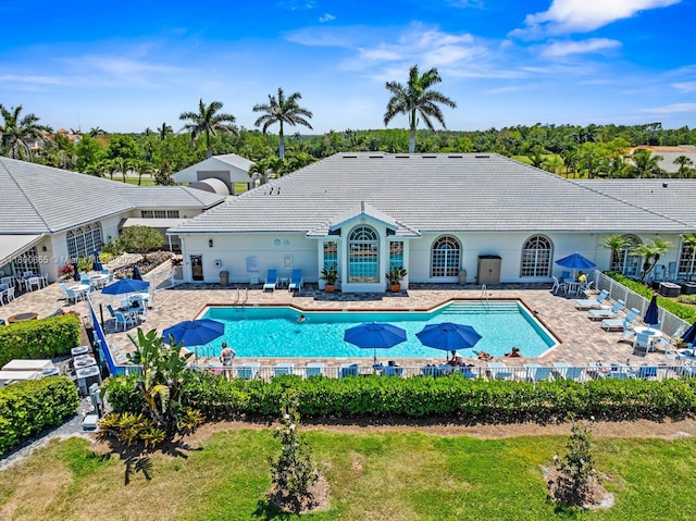 6893 Sterling Grns Unit 201, Naples, FL 34104 - community pool with fence and a patio area