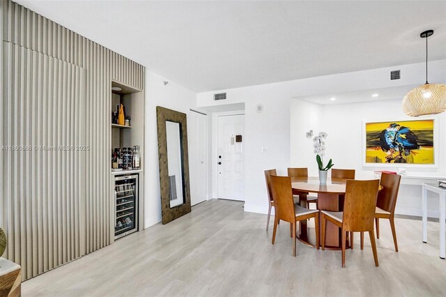 1201 S Ocean Dr Unit 404N, Hollywood, FL 33019 - dining space featuring wine cooler, light wood-type flooring, a dry bar, and recessed lighting