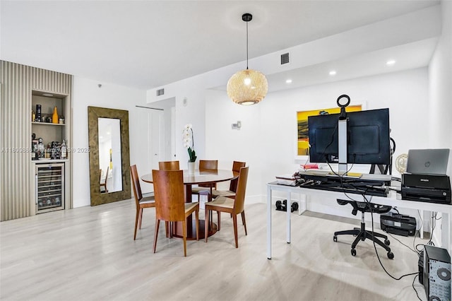 1201 S Ocean Dr Unit 404N, Hollywood, FL 33019 - dining area with beverage cooler, wood finished floors, a dry bar, recessed lighting, and baseboards