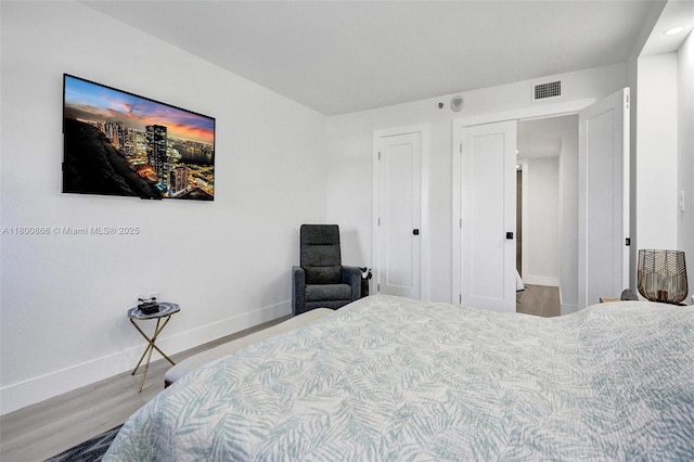 1201 S Ocean Dr Unit 404N, Hollywood, FL 33019 - bedroom featuring baseboards and wood finished floors