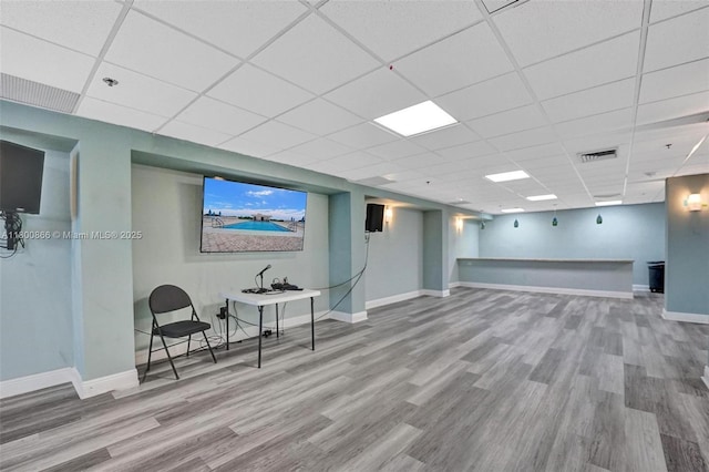 1201 S Ocean Dr Unit 404N, Hollywood, FL 33019 - finished basement with wood finished floors, a paneled ceiling, and baseboards
