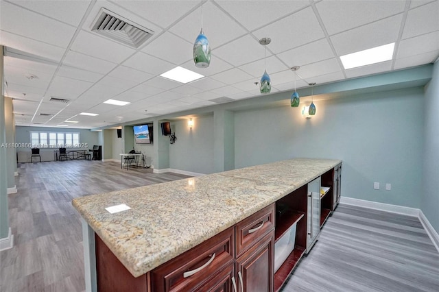 1201 S Ocean Dr Unit 404N, Hollywood, FL 33019 - bar area with baseboards, a paneled ceiling, and wood finished floors