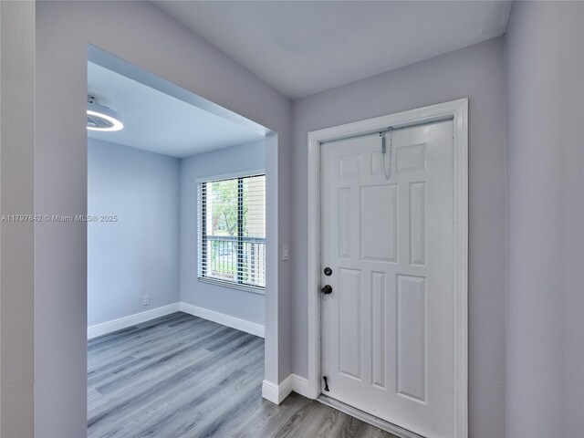 5380 Cedar Lake Dr Unit 204, Boynton Beach, FL 33437 - entryway featuring wood finished floors and baseboards