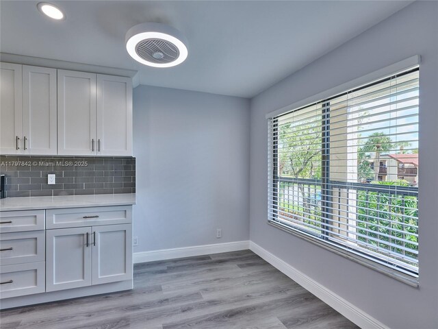 5380 Cedar Lake Dr Unit 204, Boynton Beach, FL 33437 - unfurnished dining area featuring baseboards, light wood finished floors, and recessed lighting