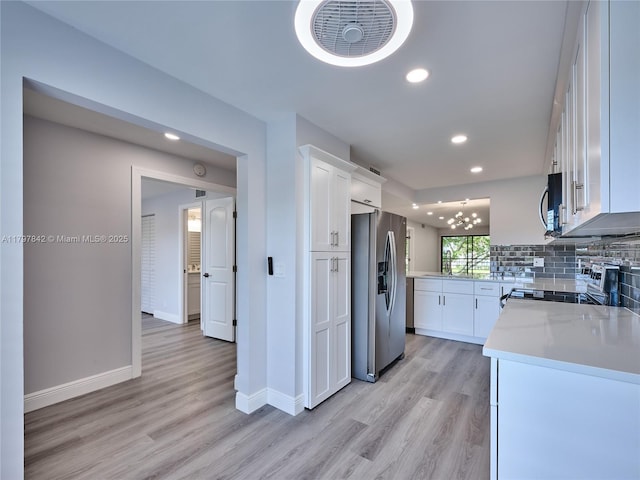 5380 Cedar Lake Dr Unit 204, Boynton Beach, FL 33437 - kitchen with appliances with stainless steel finishes, white cabinetry, light wood-style floors, light countertops, and recessed lighting