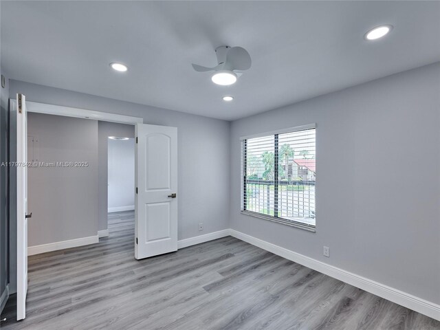 5380 Cedar Lake Dr Unit 204, Boynton Beach, FL 33437 - spare room featuring wood finished floors, a ceiling fan, baseboards, and recessed lighting